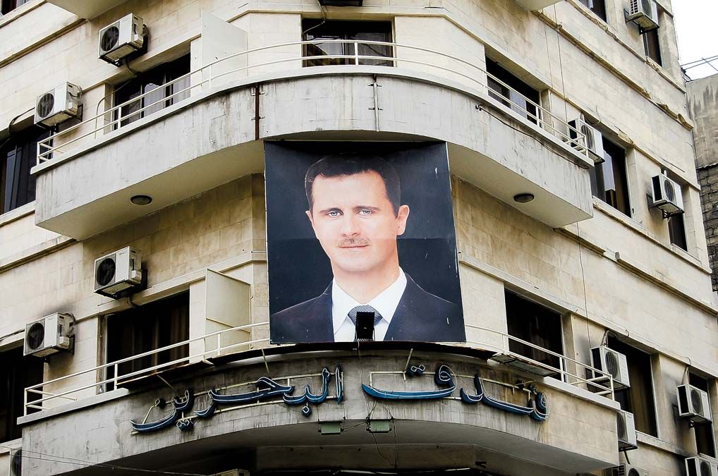 Bassár el-Aszad portréja egy damaszkuszi házon a háború előtt.<br>Fotó: Shutterstock