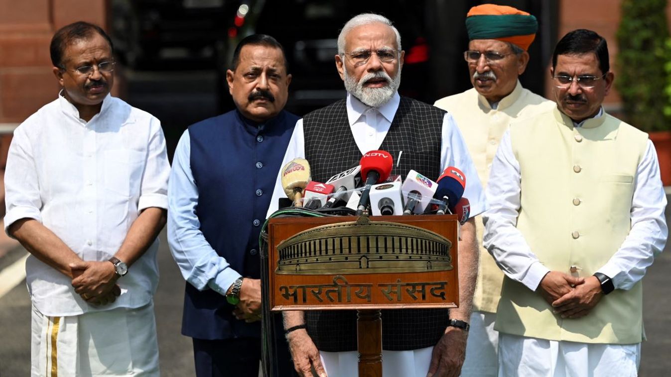 India's Prime Minister Narendra Modi (C) speaks to the media before the opening of the Monsoon session of Parliament in New Delhi on July 20, 2023.