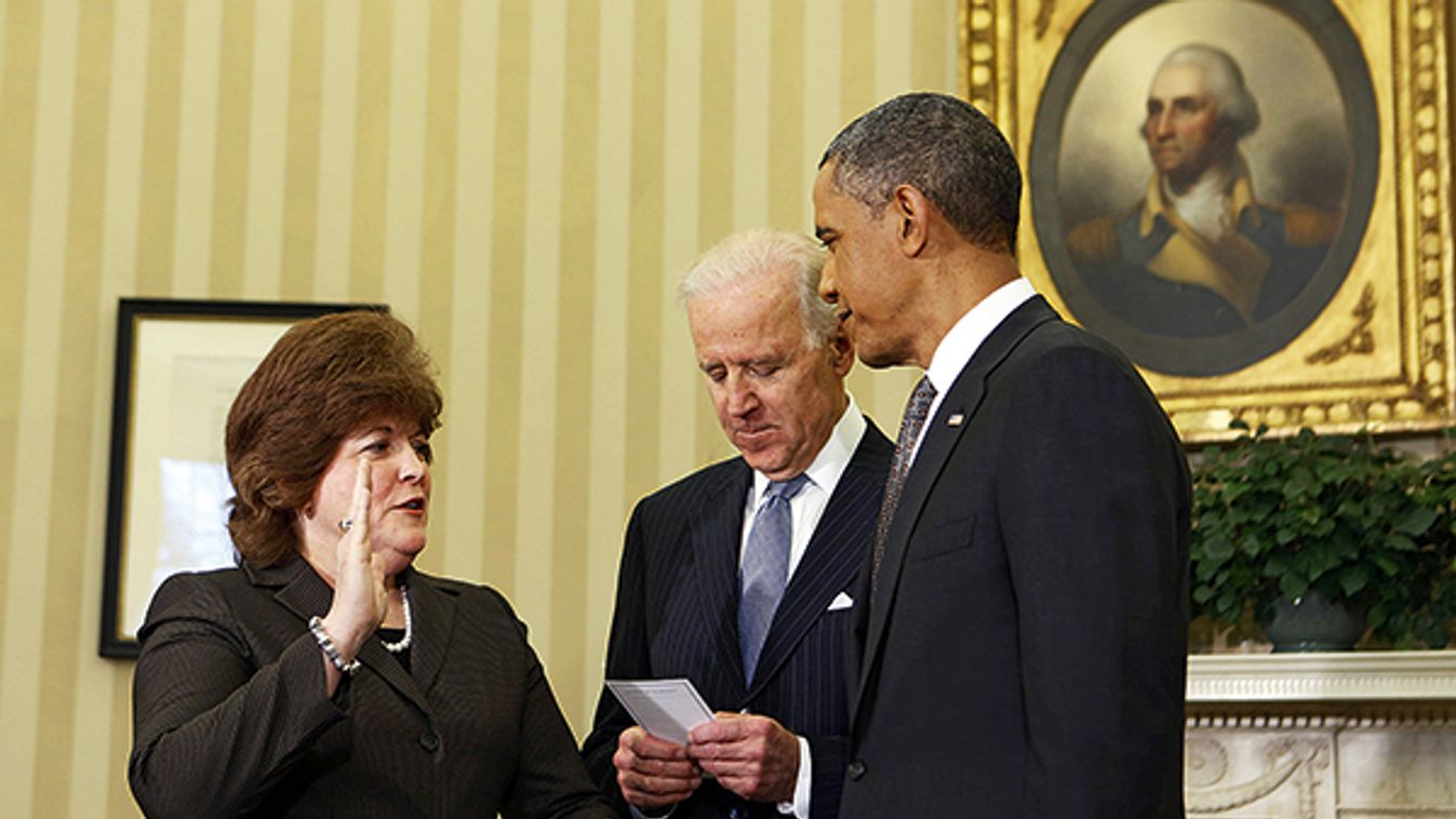 U.S. President Obama watches as U.S. Secret Service agent Pierson is sworn in as first woman Director of the Secret Service by Vice President Biden in the Oval Office of the White House in Washington