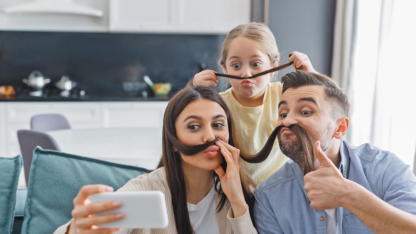 Woman,Taking,Selfie,With,Family,Having,Fun,While,Imitating,Mustache