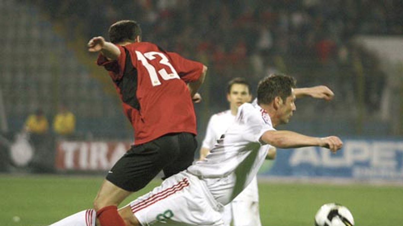 Albania's Skela fights for the ball with Hungary's Dardai in Tirana