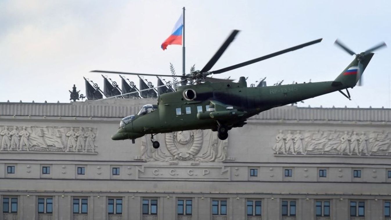 A Mi-35MS (a flying comandopost variant) helicopter flies past the headquarters of Russia's Defence Ministry in central Moscow, on March 9, 2016.