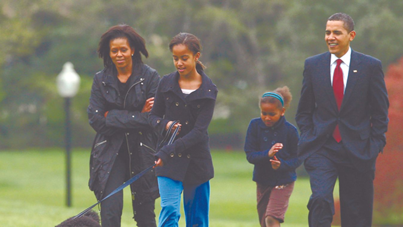 U.S. President Barack Obama walks with his family and their new pet dog Bo on the South lawn at the White House in Washington