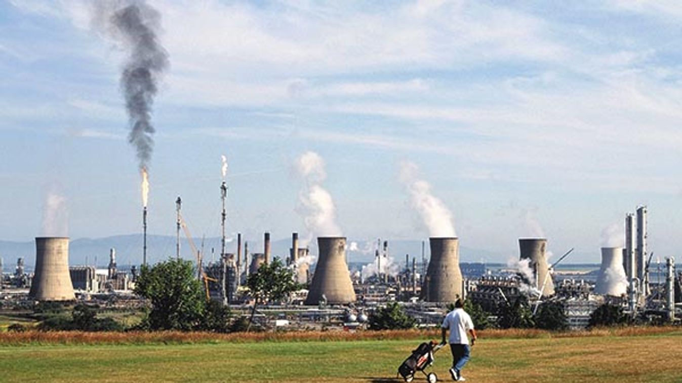 Grangemouth golf course and oil refinery installations with golfer