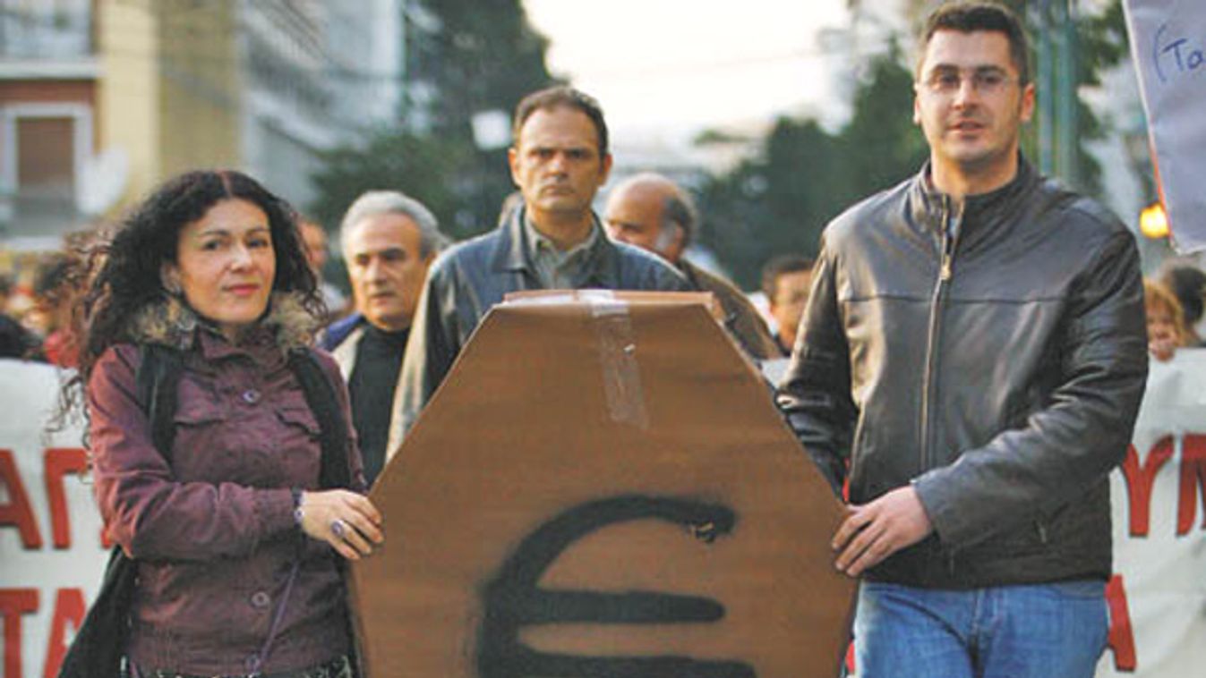 Protesters carry a mock coffin during a rally in Athens