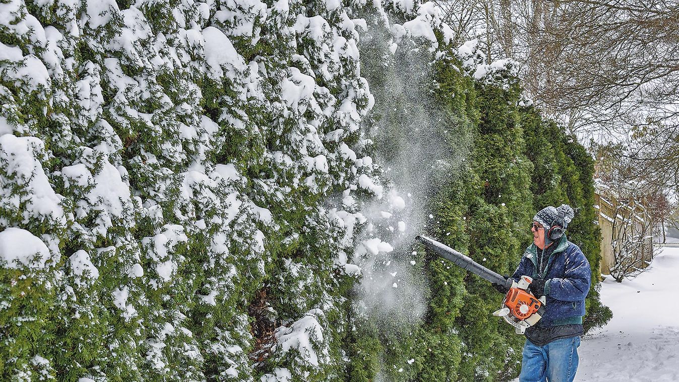 Snowy,Day,,Senior,Man,Using,A,Snow-blower,To,Remove,Snow