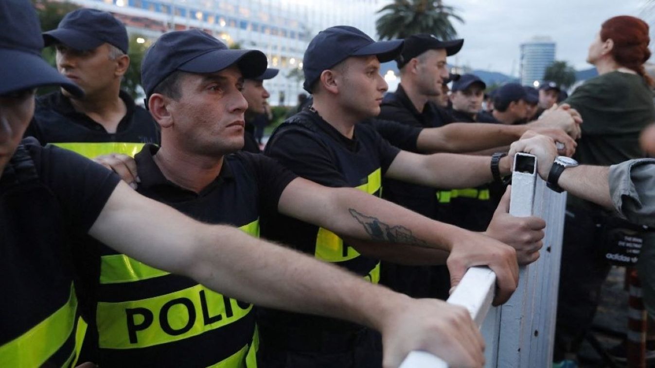 Police take security measures as a group of protesters, opposing the arrival of the cruise ship departing from the Russian city of Sochi to Georgia, gather to protest at the Batumi Port in Batumi, Georgia on July 31, 2023. 