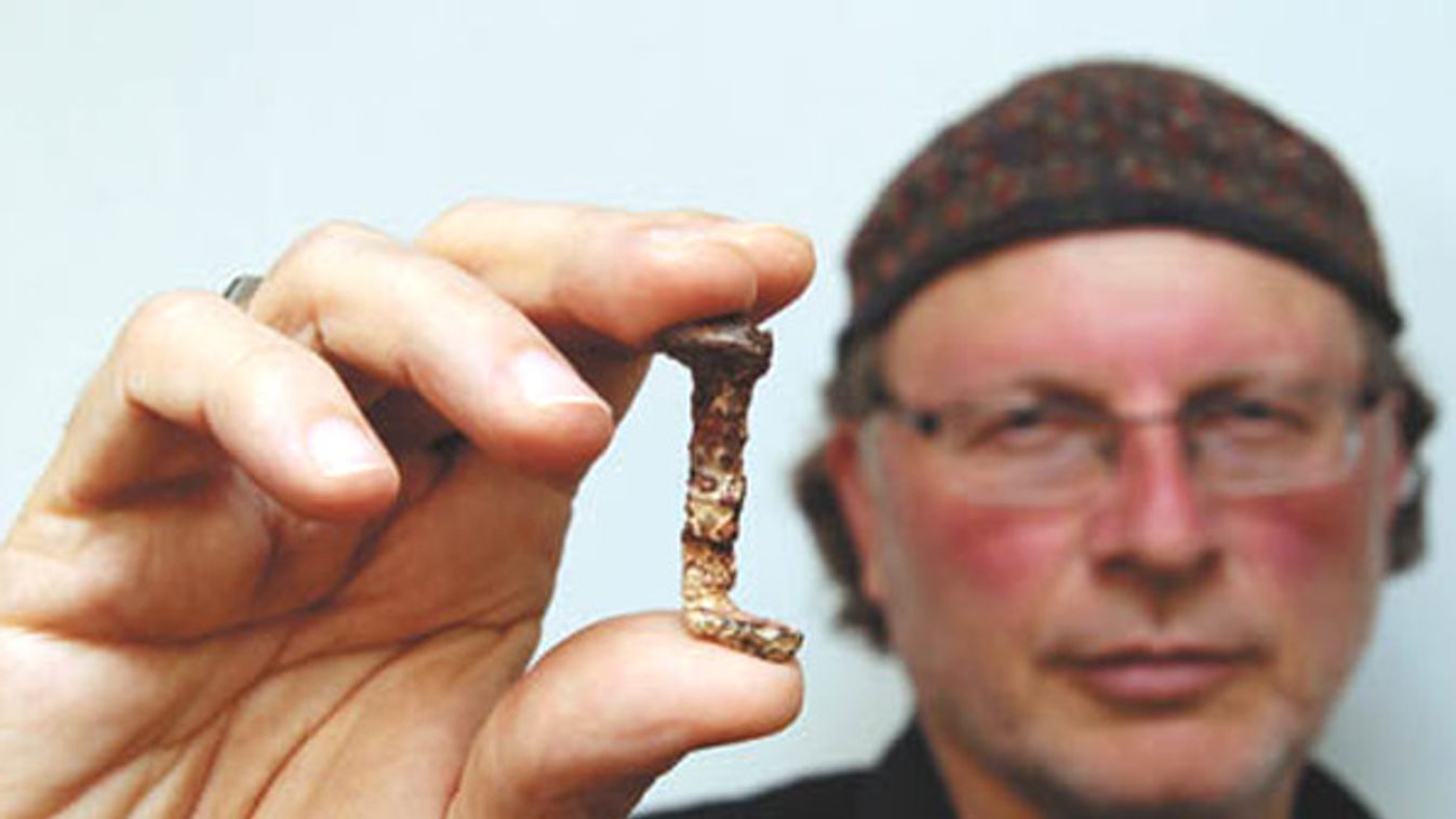 Veteran investigator Simcha Jacobovici holds one of the two nails presented in his new documentary film as having a connection to Jesus at Tel Aviv University