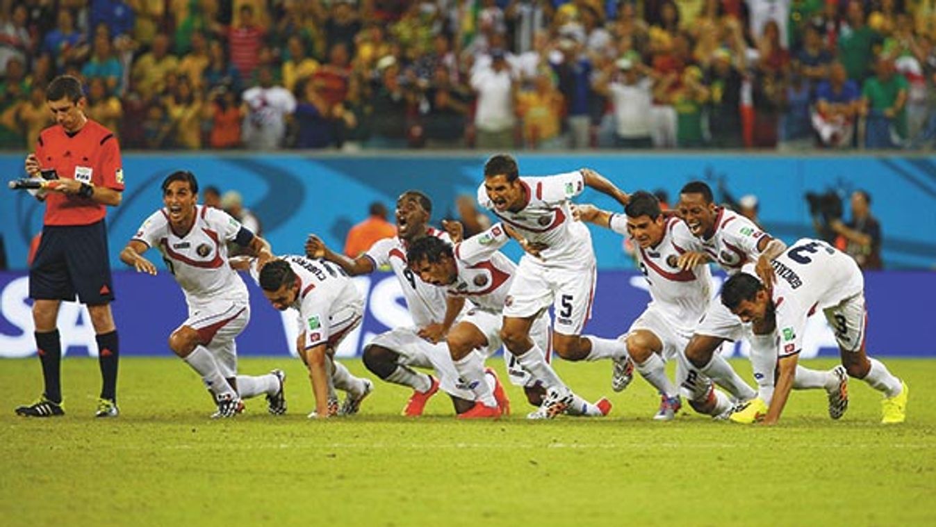 Costa Rica's players celebrate winning their 2014 World Cup round of 16 game against Greece at the Pernambuco arena in Recife