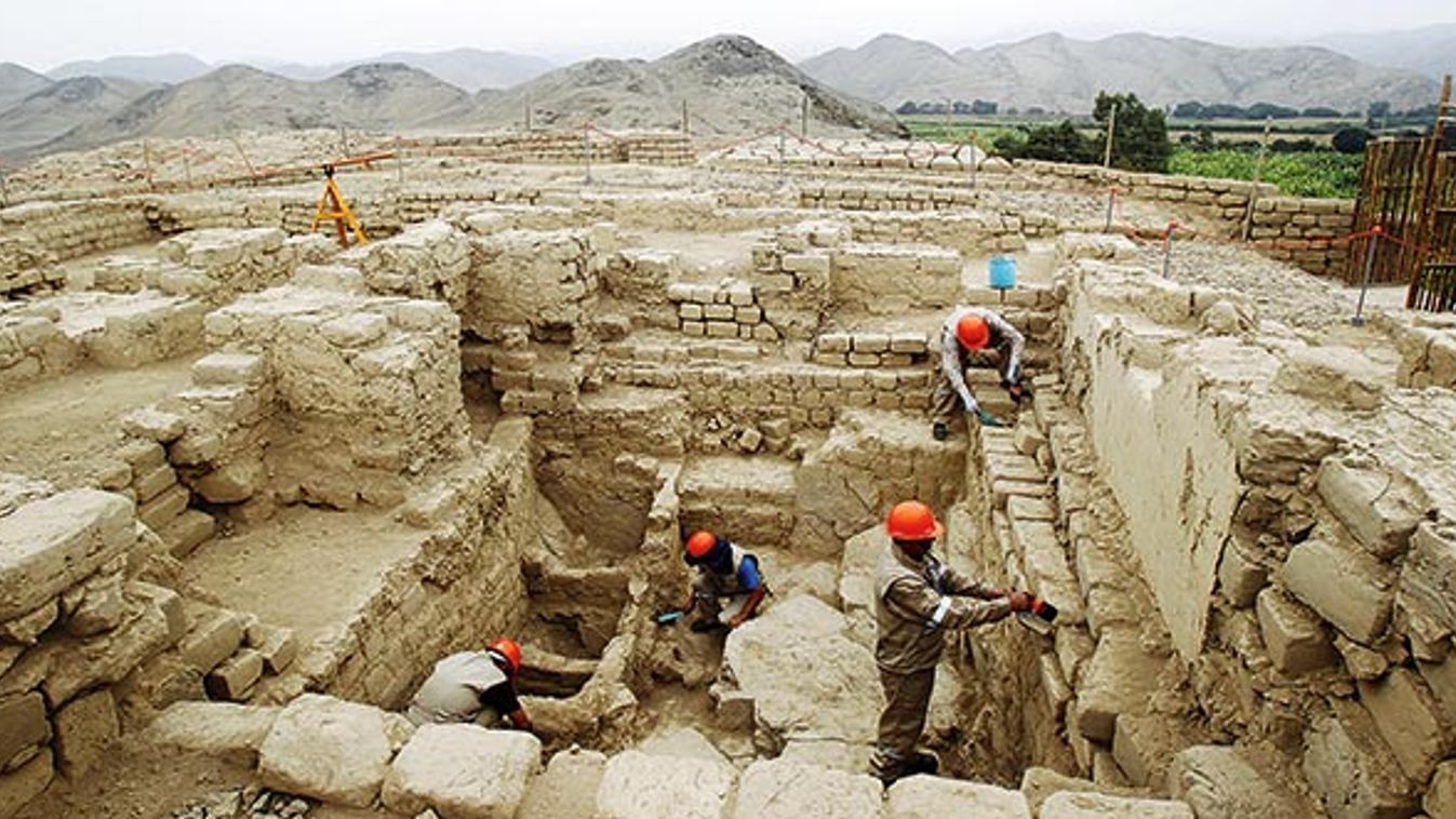 Workers brush the remains of a coastal pyramid site called El Castillo de Huarmey