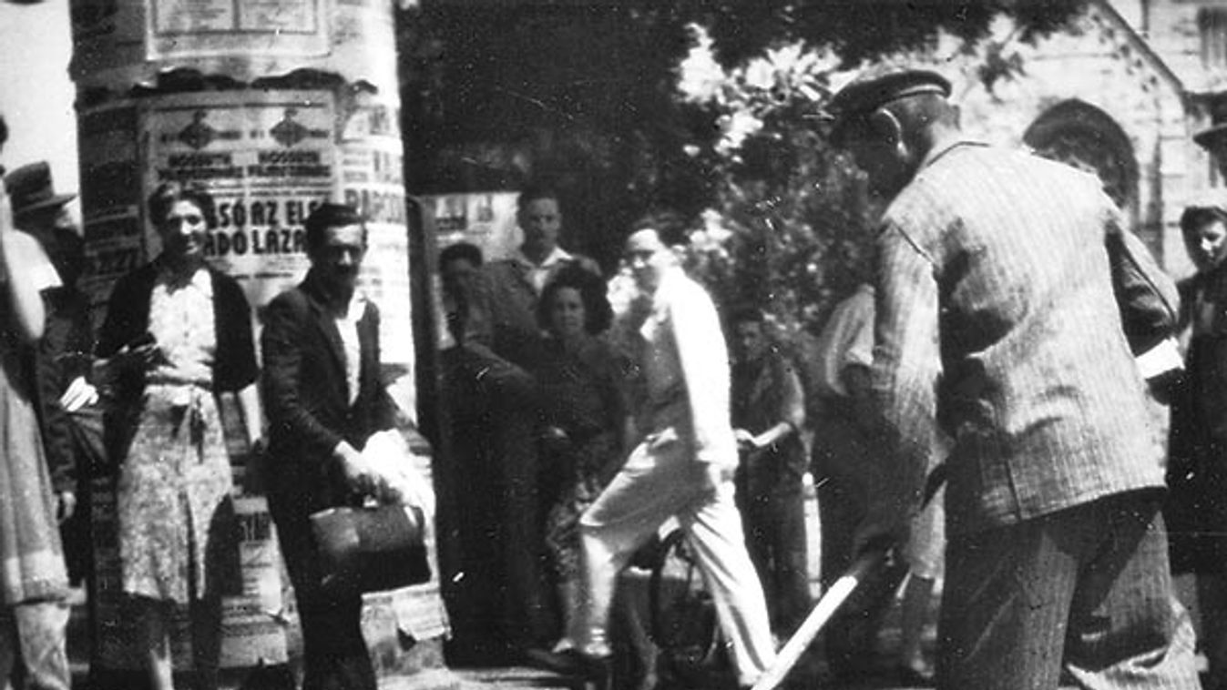 A man sweeping up worthless currency on a street in Budapest (?), Hungary. Destructive hyper-inflation after World War 2 (1945-46) paralyzed the the economic life of Hungary before the introduction of the Forint.