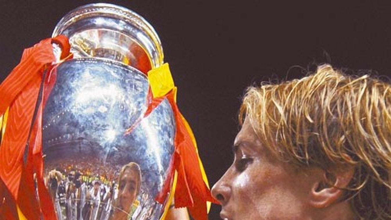 Spain's Torres holds up the trophy after defeating Germany in their Euro 2008 final soccer match in Vienna