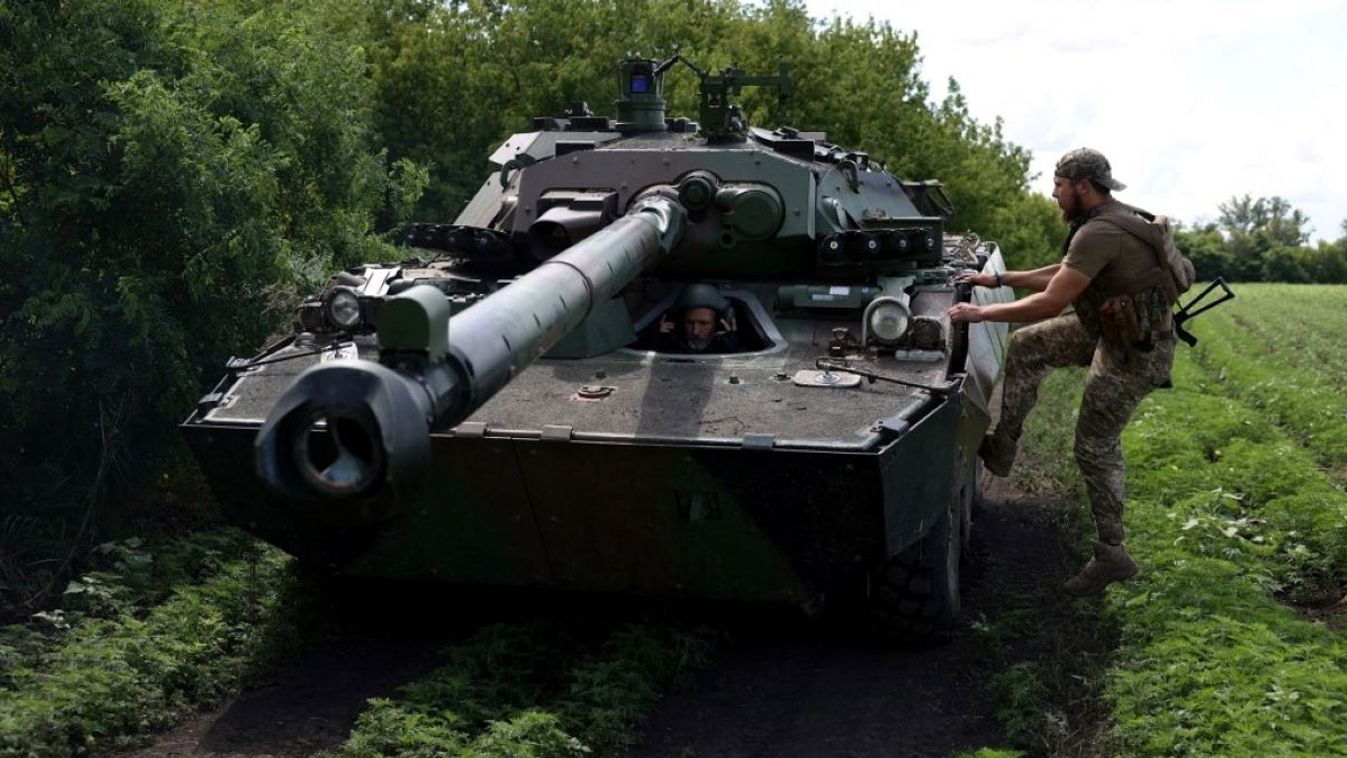 Ukrainian marines from the 37th Brigade check their French-made AMX-10 RC armoured fighting vehicle at a position in the Donetsk region on July 10, 2023.