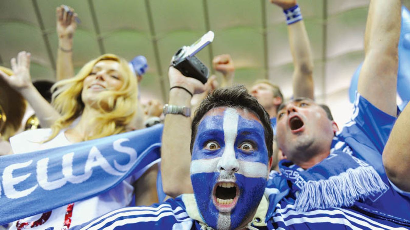 Greece's soccer fans celebrate victory against Russia after their Group A Euro 2012 soccer match at the National stadium in Warsaw