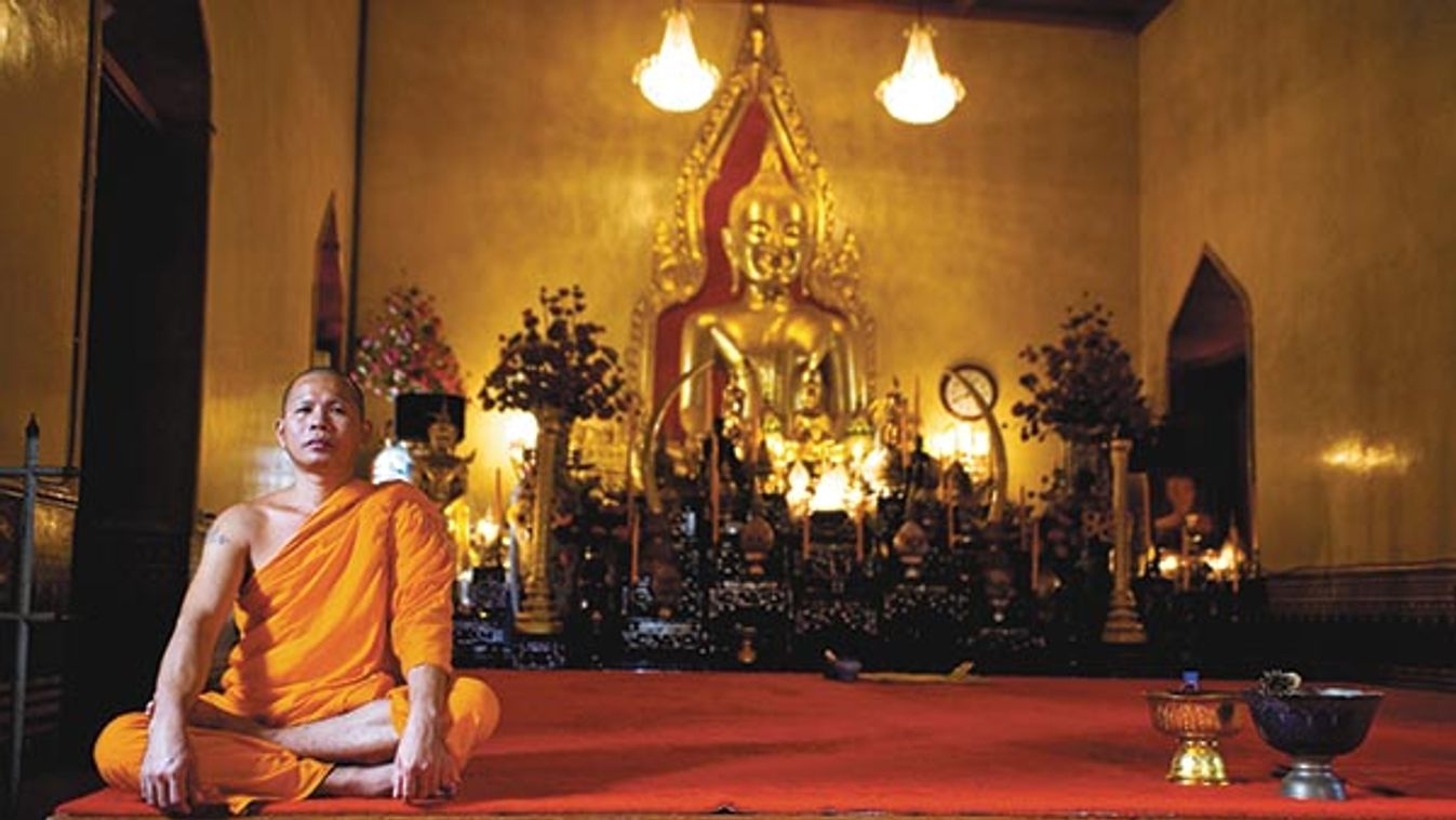 Buddhist Monk At A Lotus Posture Is Guarding A Room At The Premises Of Wat Traimit Temple Bangkok Th