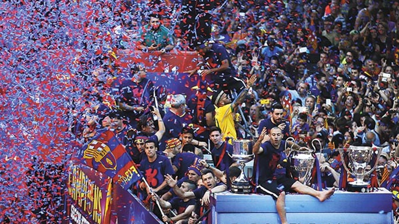 Barcelona's Mascherano and his team mates celebrate from an open-top bus during celebration parade in Barcelona
