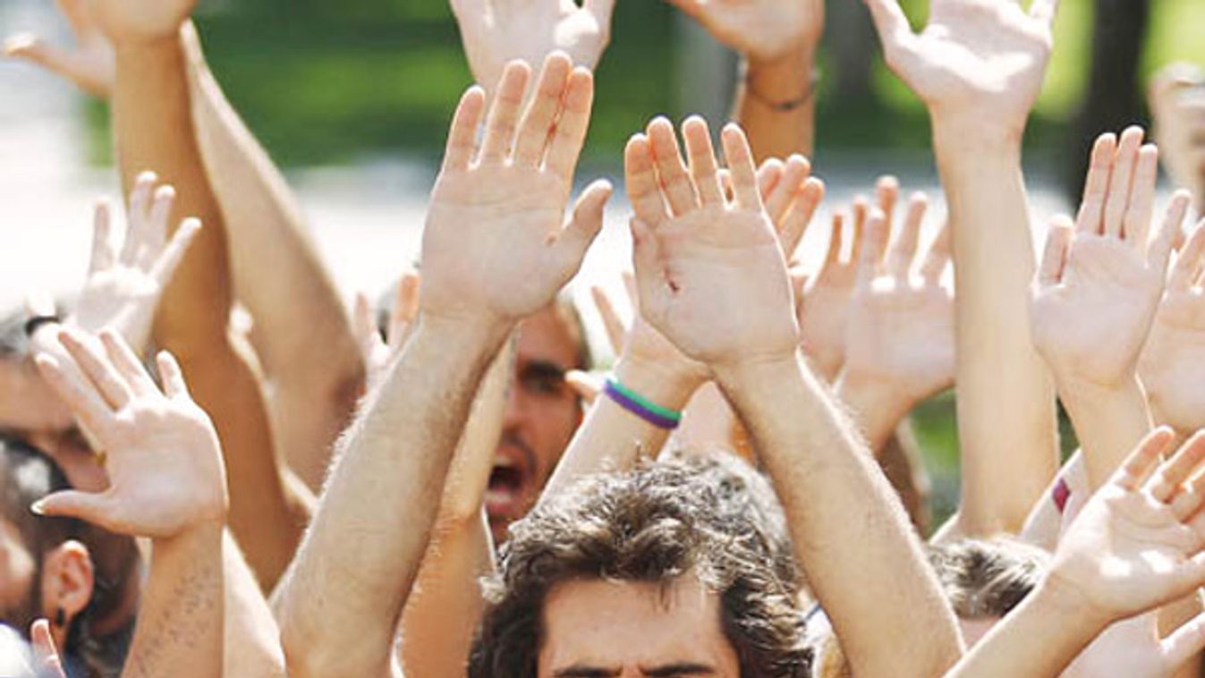 Demonstrators protest against collective bargaining reforms in front of Spain's labour ministry in Madrid