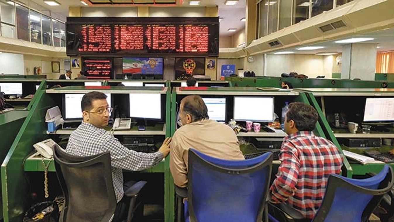 Stock market employees work at Tehran's Stock Exchange
