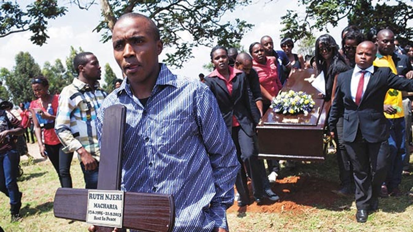 Family, friends and work colleagues attend the funeral of Ruth Njeri Macharia at Langata Cemetery in Nairobi, Kenya.