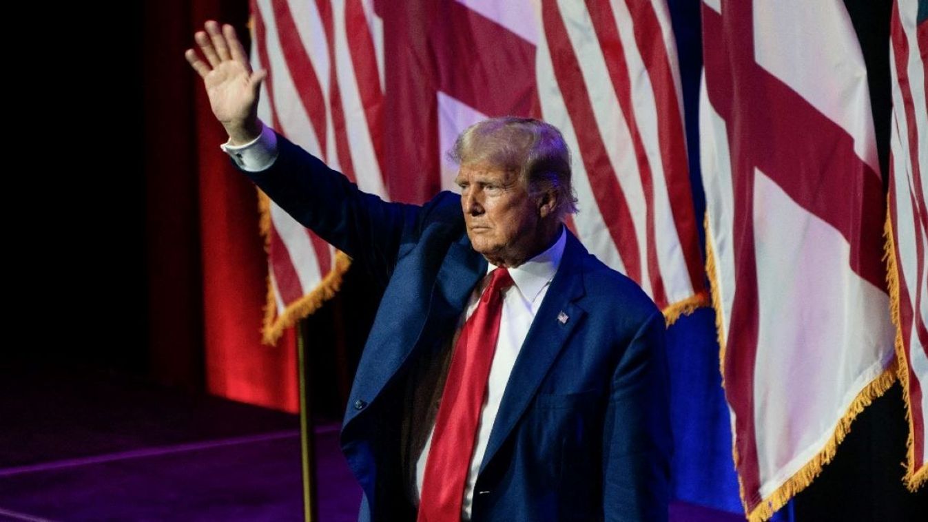 Former US President and 2024 hopeful Donald Trump waves as he leaves after speaking at the Alabama Republican Party's summer dinner in Montgomery, Alabama, on August 4, 2023.