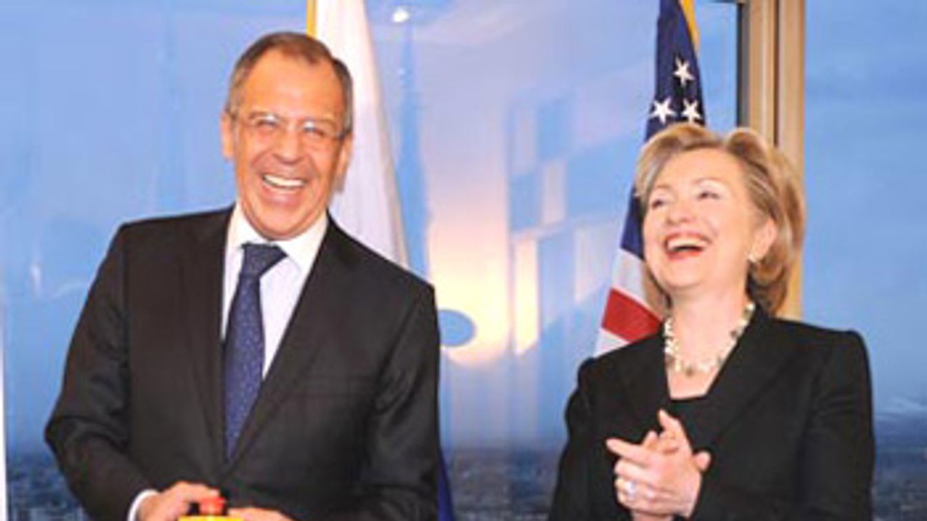 U.S. Secretary of State Clinton laughs with Russia's Foreign Minister Lavrov in Geneva