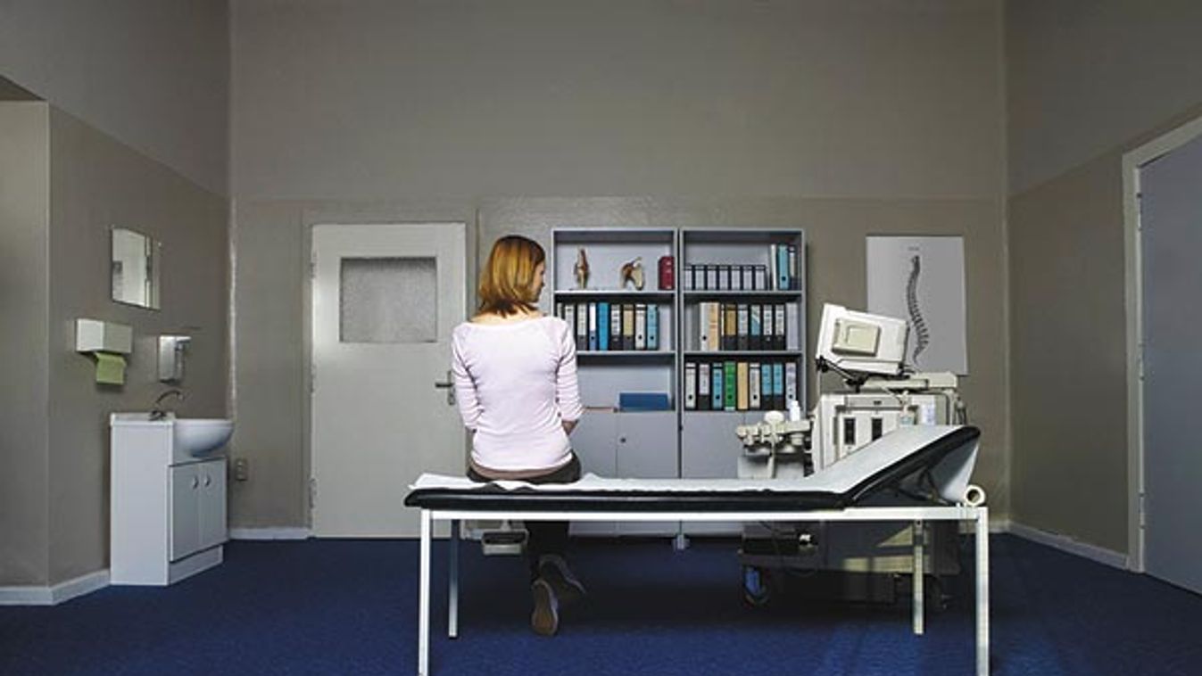 Woman Waiting in Examination Room