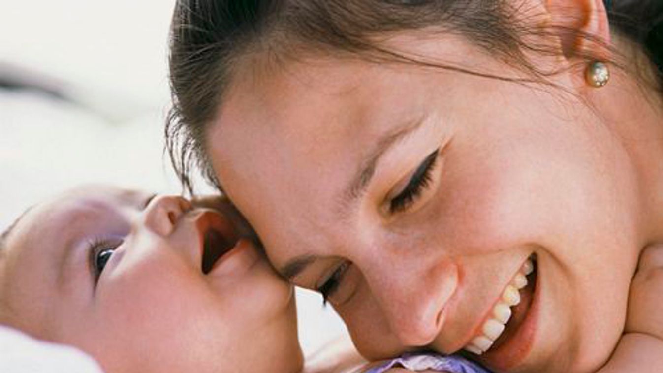 Mother Resting Head on Infant's Chest