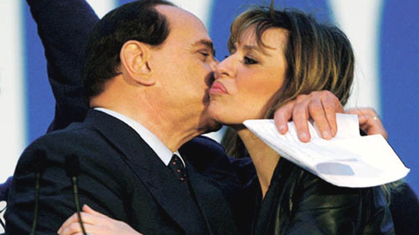 Italian PDL centre-right leader Berlusconi kisses Alessandra Mussolini, granddaughter of dictator Benito Mussolini, in Rome