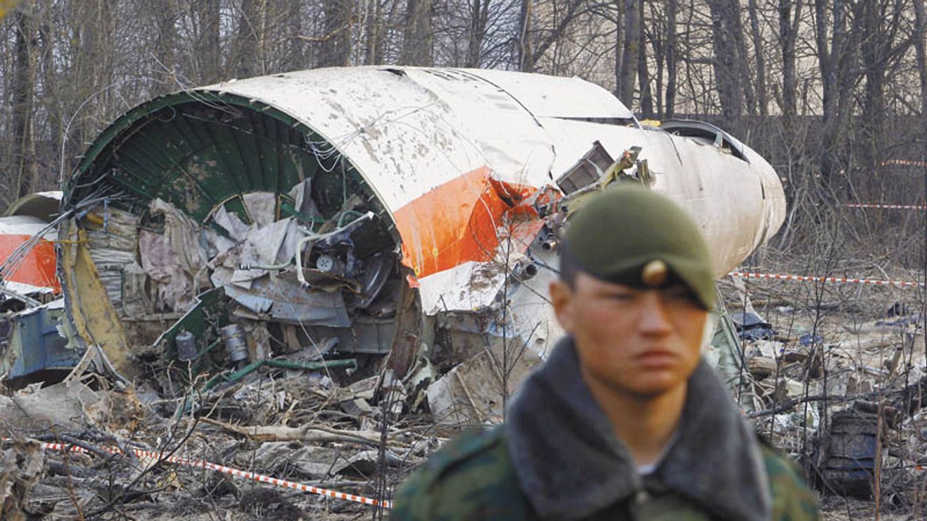Russian serviceman stands guard near part of the wreckage of a Polish government Tupolev Tu-154 aircraft that crashed near Smolensk airport