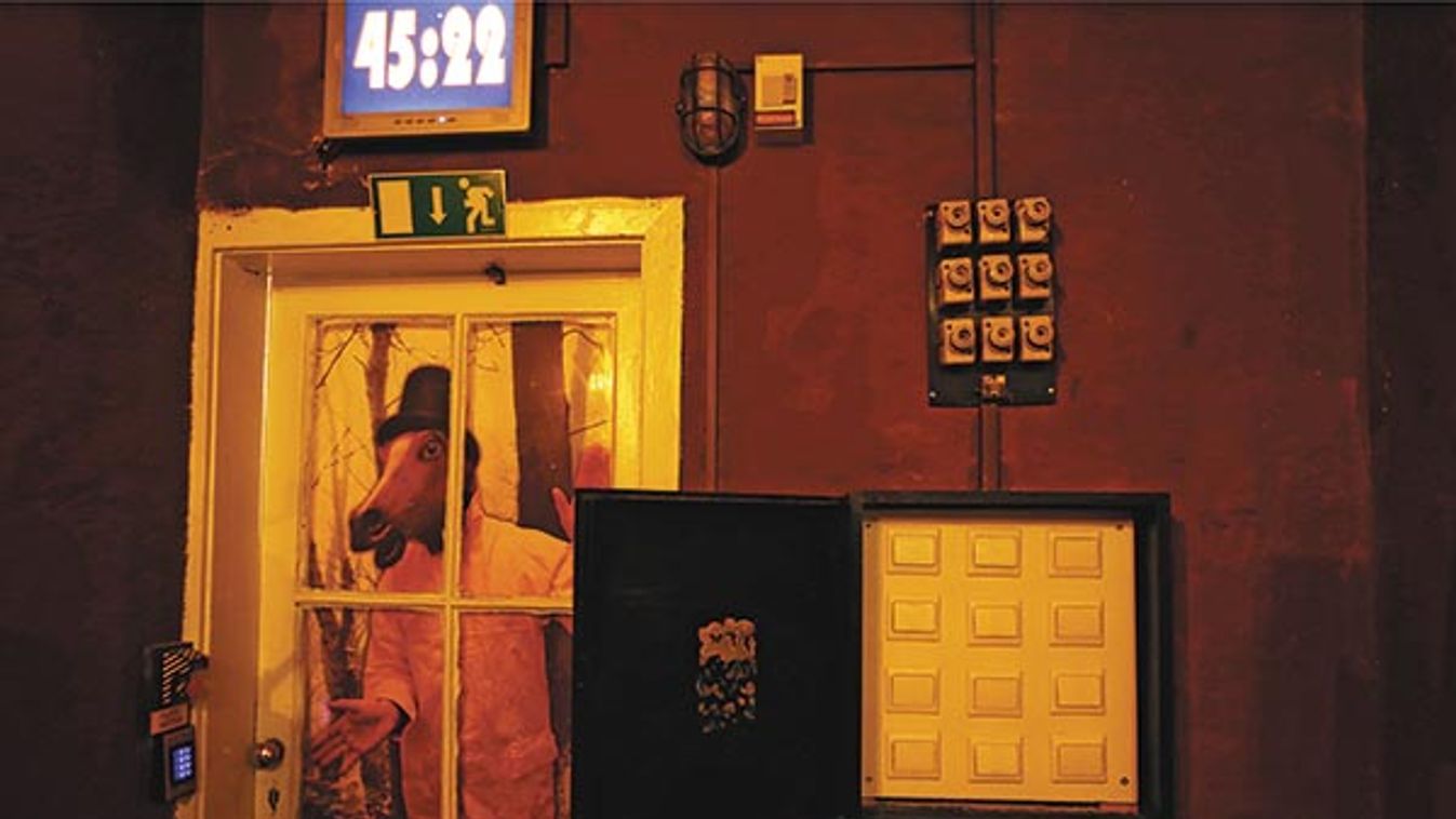 A clock, clues and locks are seen in an escape room at ExitPointGames in Budapest