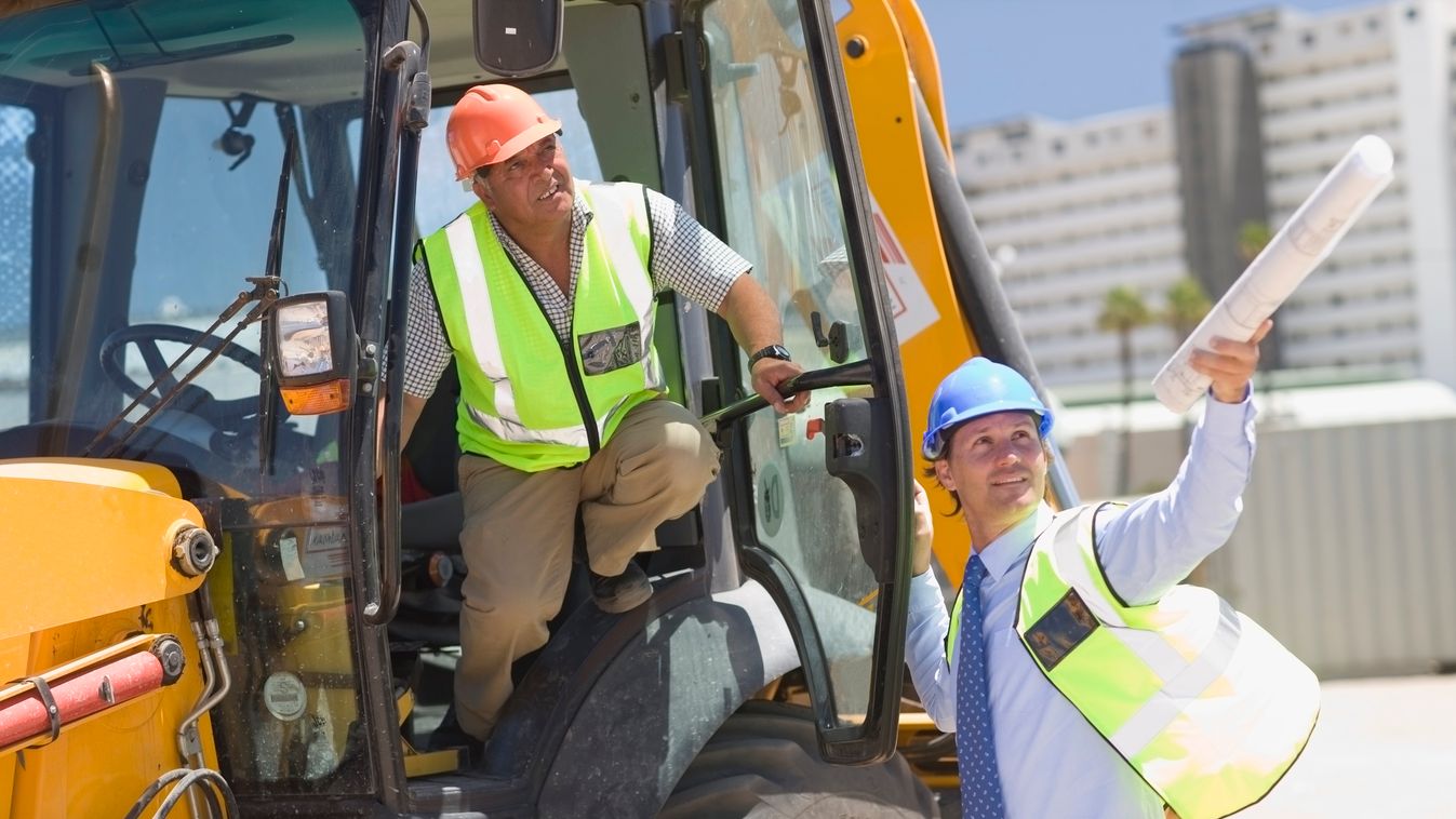 Architect talking to a building worker