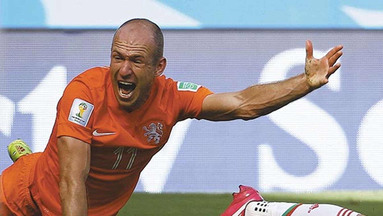 Robben of the Netherlands reacts after being by Mexico's Layun during their 2014 World Cup round of 16 game at the Castelao arena in Fortaleza 