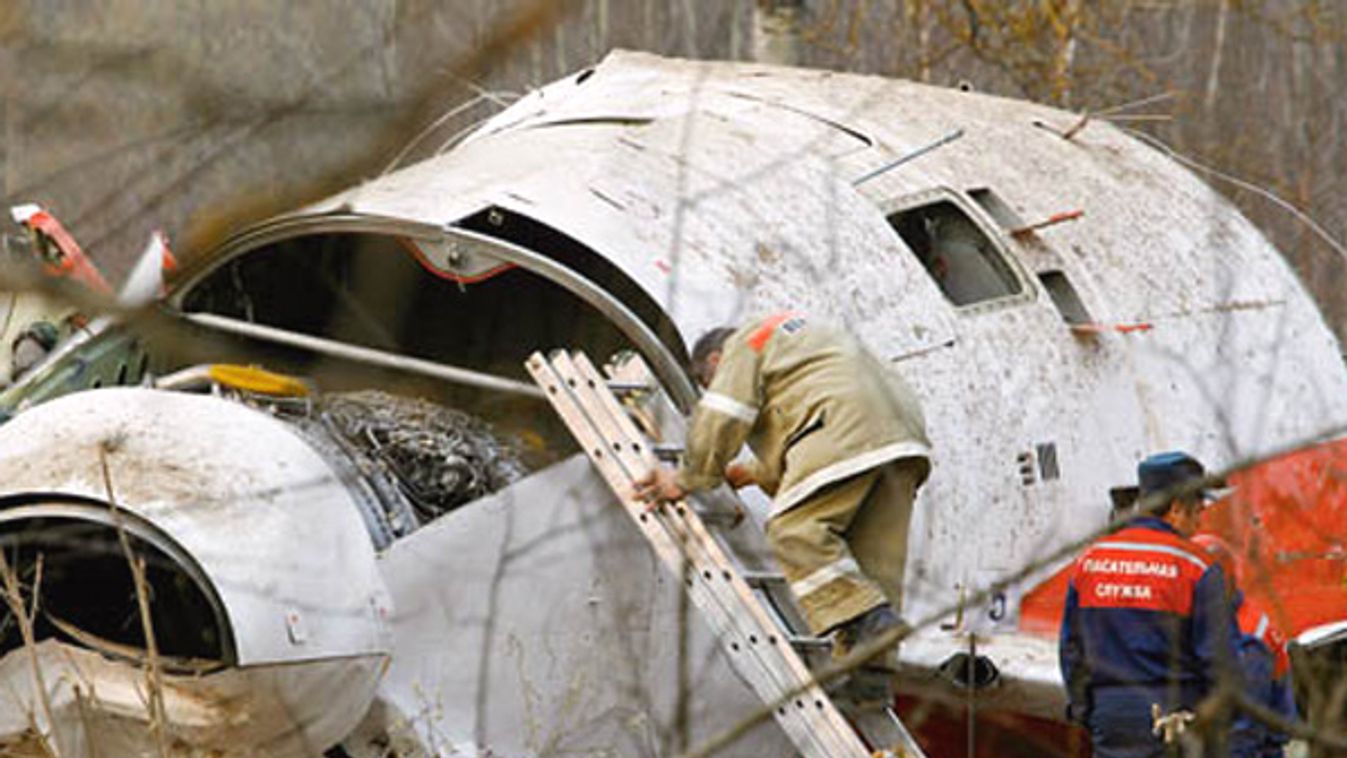 Experts collect and investigate the wreckage at the site of the Tupolev Tu-154 aplane crash in Smolensk