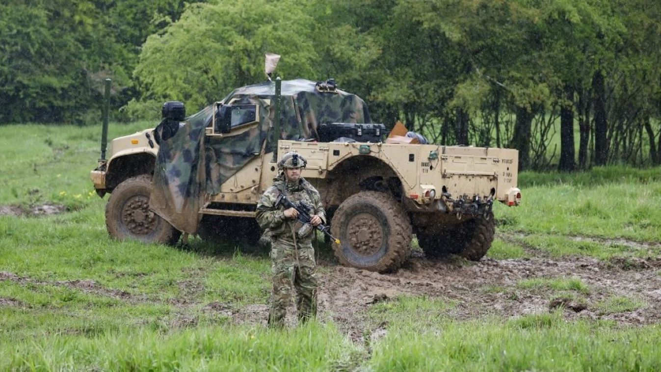 An American soldier stands in front of an Oshkosh Joint Light Tactical Vehicle, or JLTV, during U.S. Army Media Day.