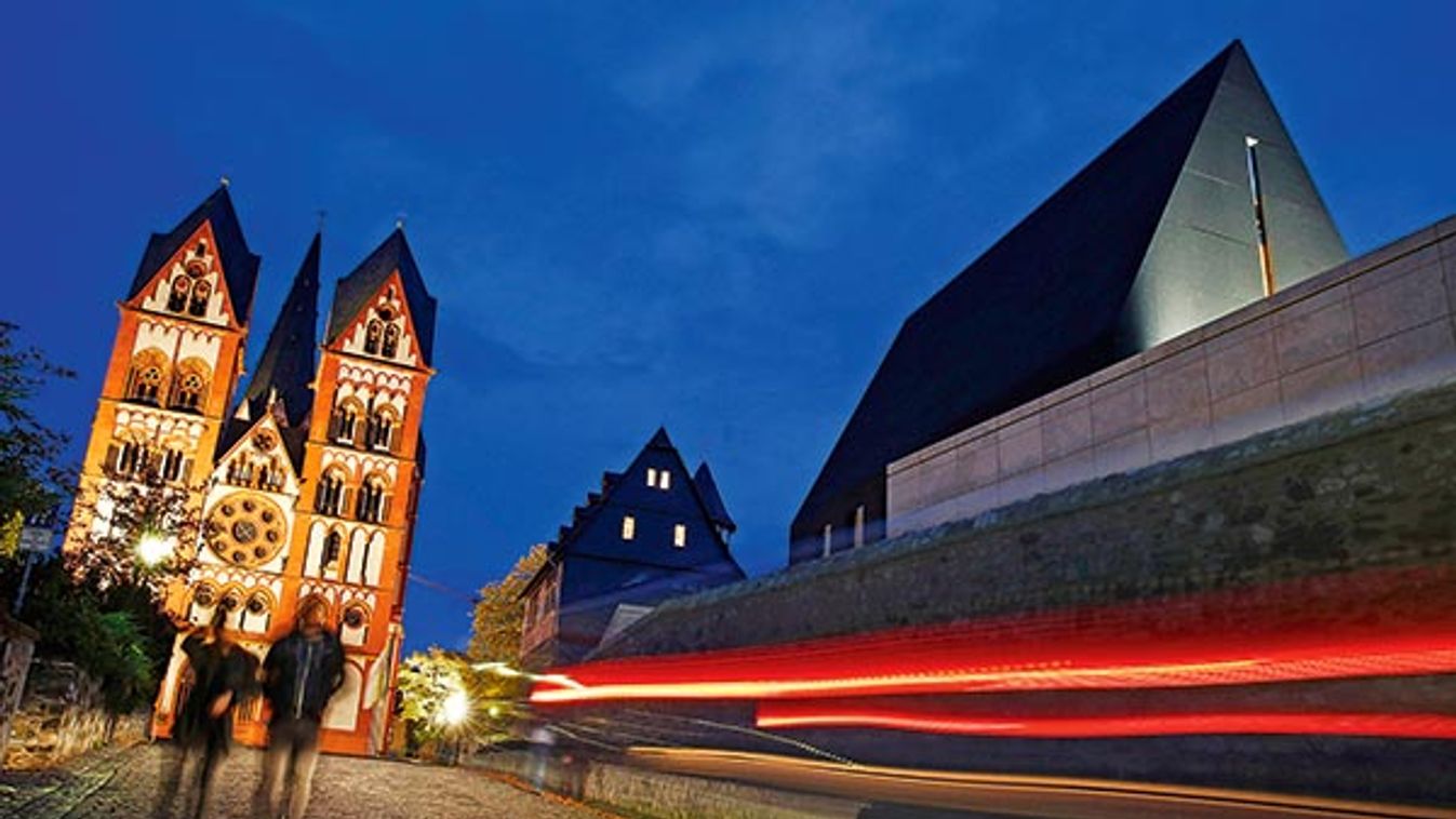 A car drives past the residence of Tebartz-van Elst next to Limburg Cathedral in Limburg