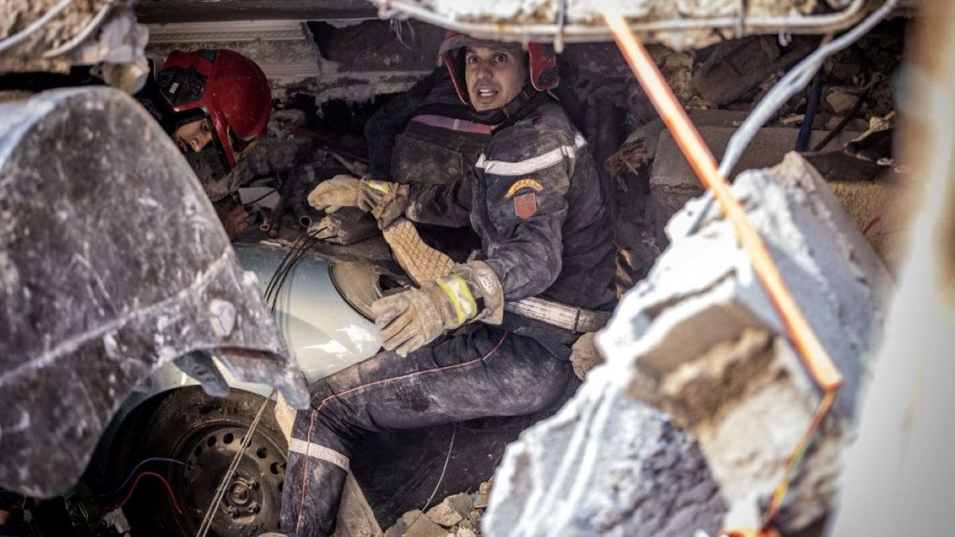 Rescue workers search for survivors in a collapsed house in Moulay Brahim, Al Haouz province, on September 9, 2023, after an earthquake. Morocco's deadliest earthquake in decades has killed at least 820 people, officials said on September 9, causing widespread damage and sending terrified residents and tourists scrambling to safety in the middle of the night.