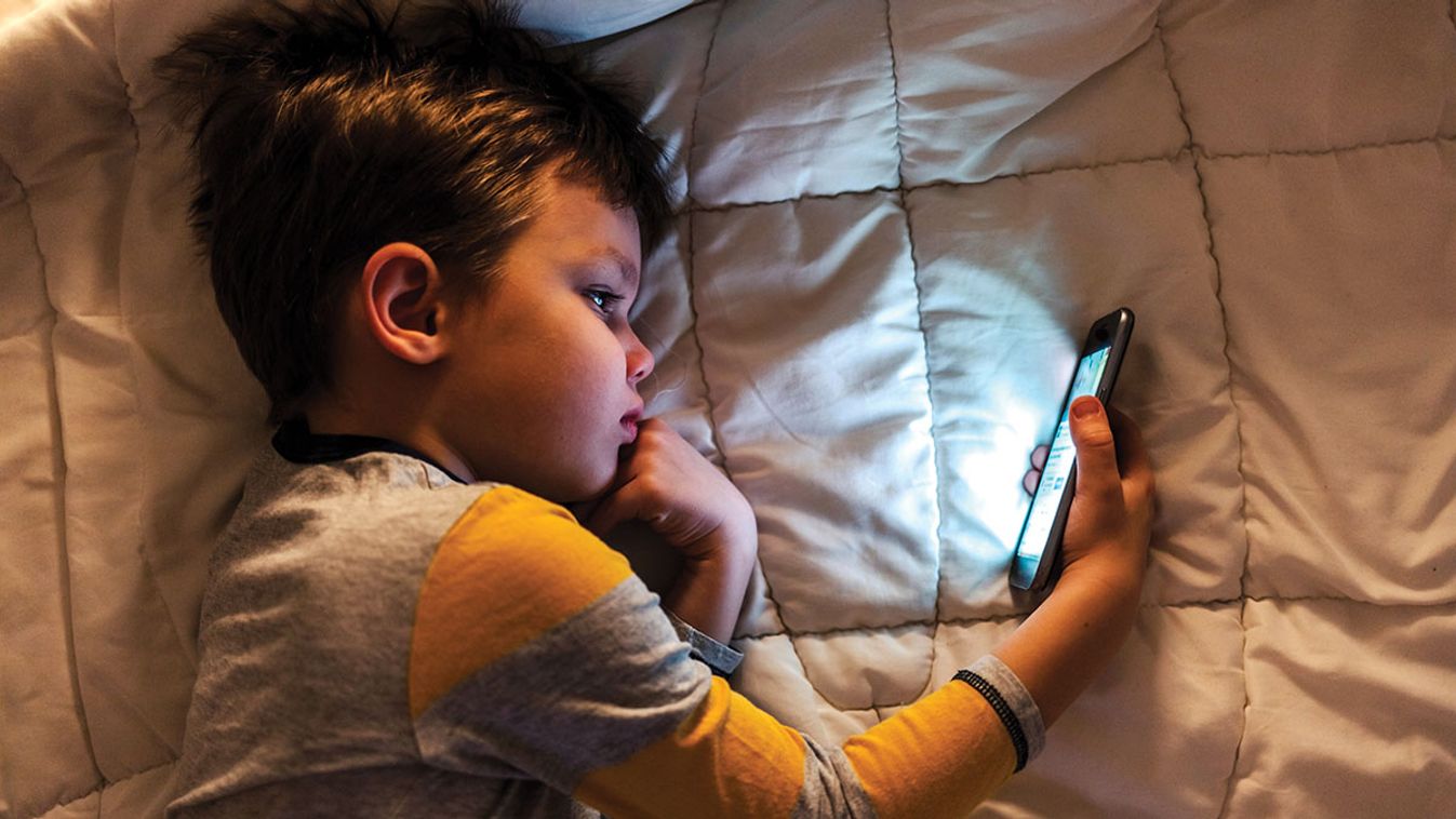 Cute,Little,Boy,Using,A,Smartphone.,Kid,Playing,With,Mobile