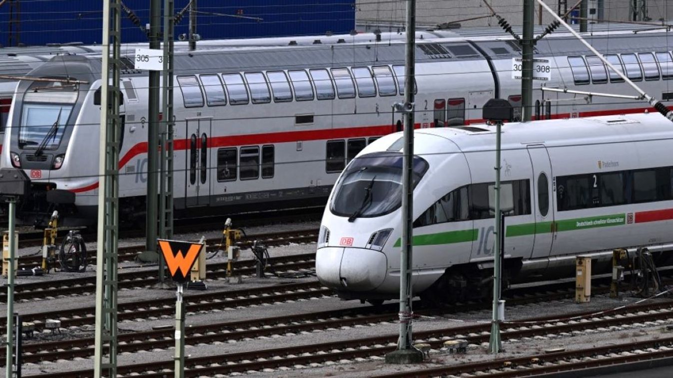 An ICE Inter City Express train (R) of German railway operator Deutsche Bahn (DB) and IC Inter City train stand on sidings at a depot in Dortmund, western Germany on August 8, 2023.