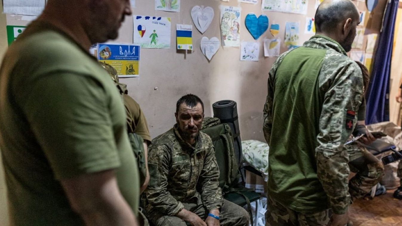 A wounded Ukrainian soldier waits to be treated at a stabilization point in Northern Donetsk Oblast, Ukraine on July 19, 2023.