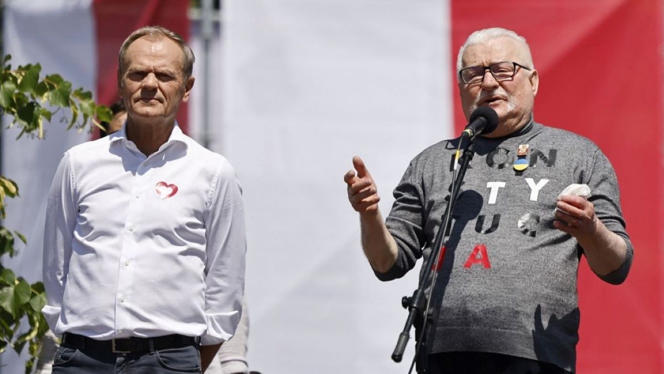 Donald Tusk, leader of the Polish Civic Platform (Platforma Obywatelska (PO) party (L) and Poland's former president Lech Walesa speak during an anti-government demonstration organized by the opposition in Warsaw on June 4, 2023.