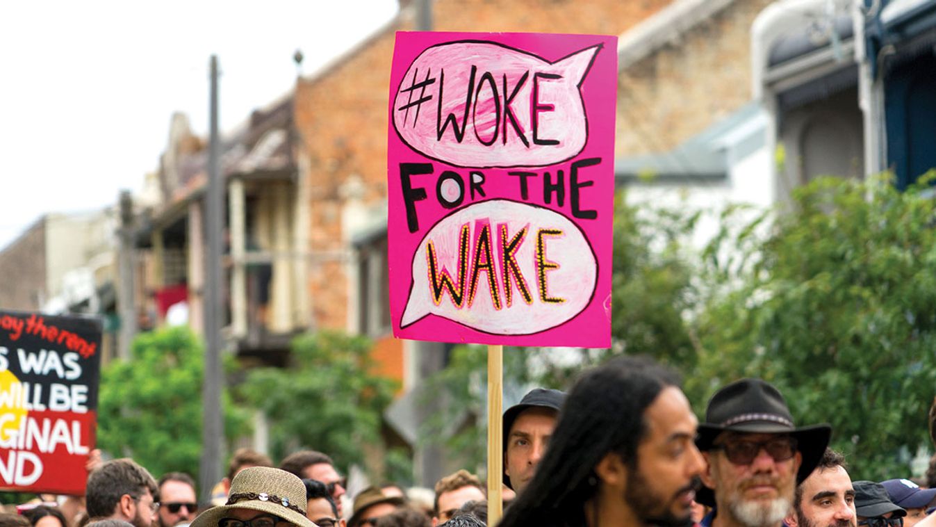 26,Jan,2018.,Sydney,,Australia.,Protestor,Holds,Sign,Saying,"#woke