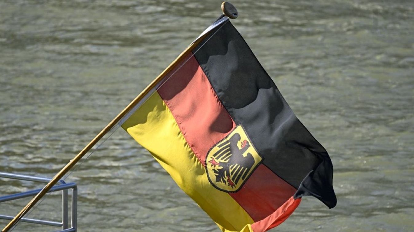 A German flag flies on a ship on the Rhine.