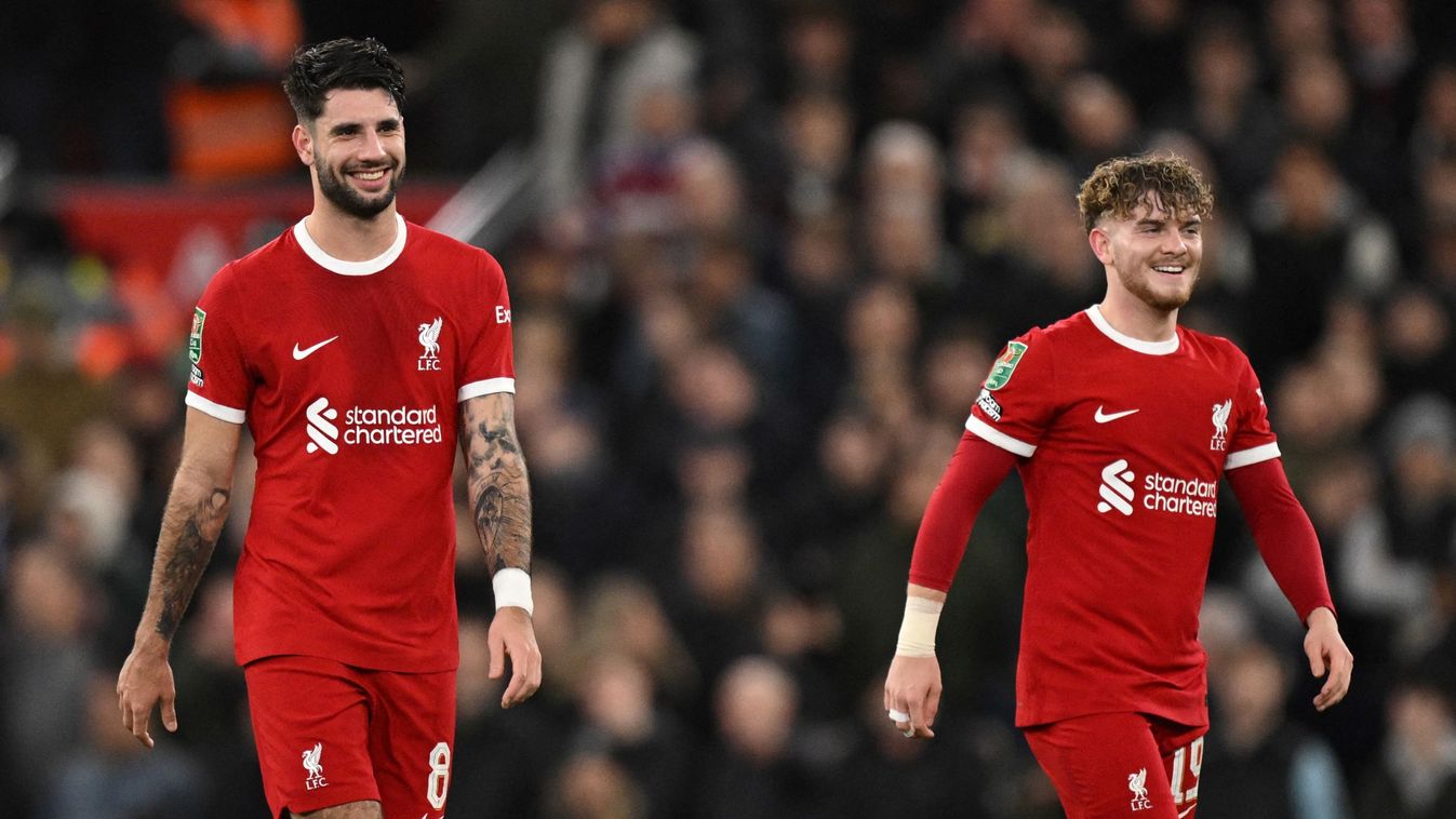 Liverpool's Hungarian midfielder #08 Dominik Szoboszlai (L) celebrates after scoring his team first goal during the English League Cup quarter-final football match between Liverpool and West Ham United at Anfield in Liverpool, north west England on December 20, 2023. (Photo by Oli SCARFF / AFP)