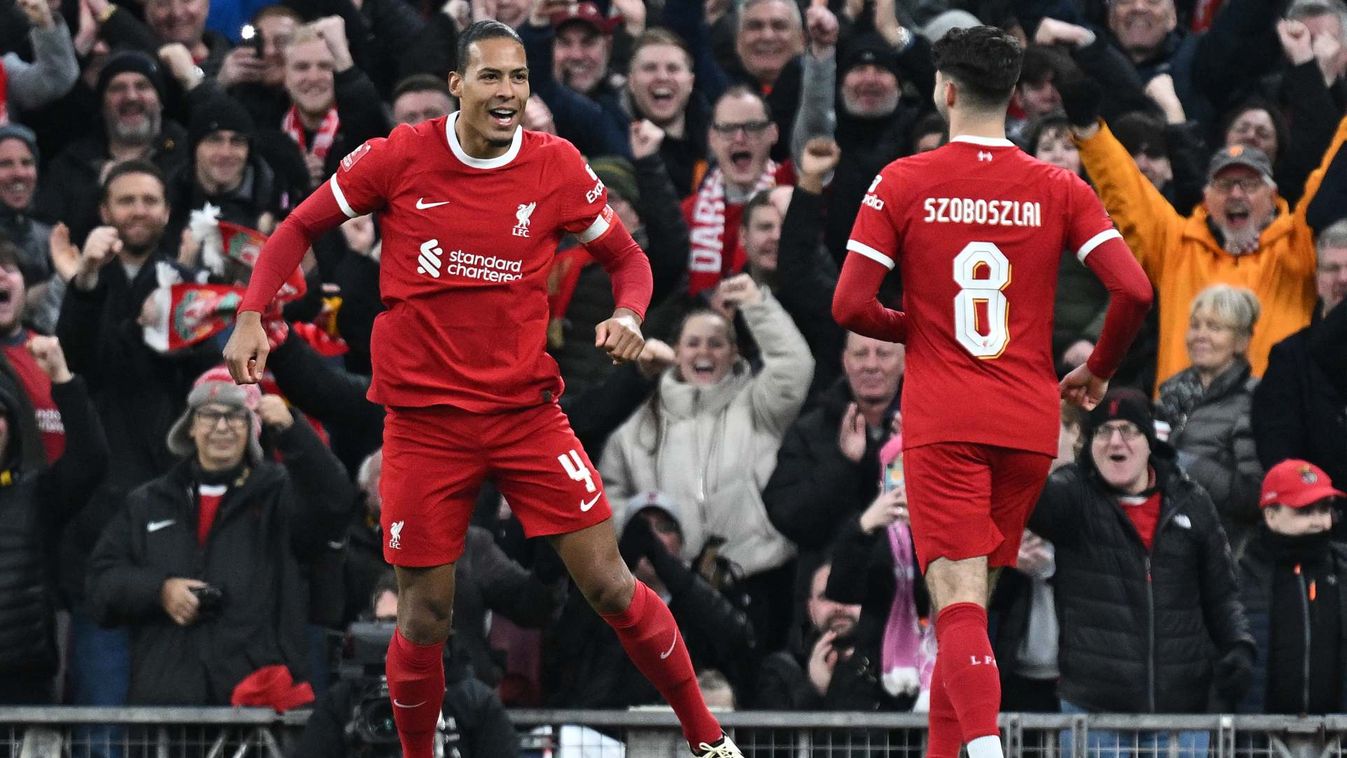 Liverpool's Dutch defender #04 Virgil van Dijk (L) celebrates scoring the team's fourth goal with Liverpool's Hungarian midfielder #08 Dominik Szoboszlai during the English FA Cup fourth round football match between Liverpool and Norwich City at Anfield i
