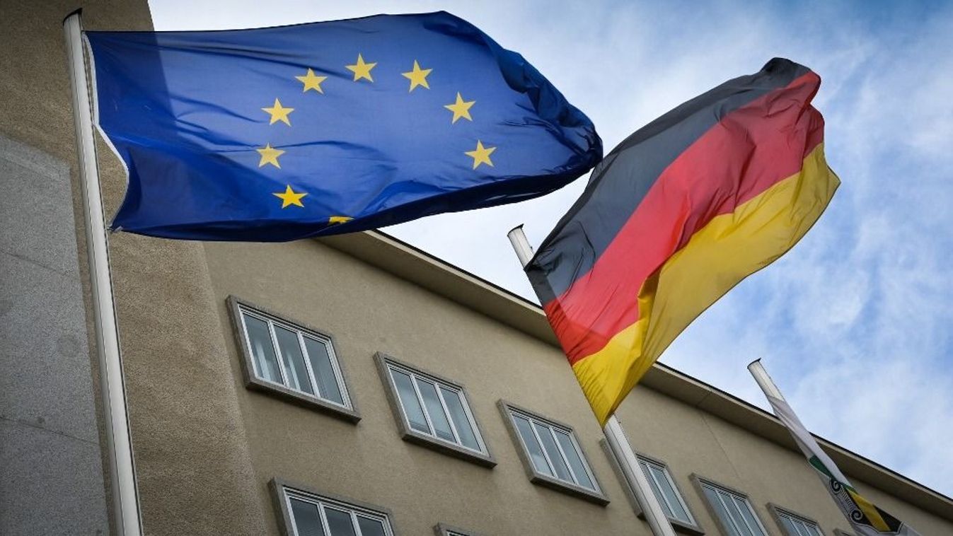 European flag and German flag in the wind