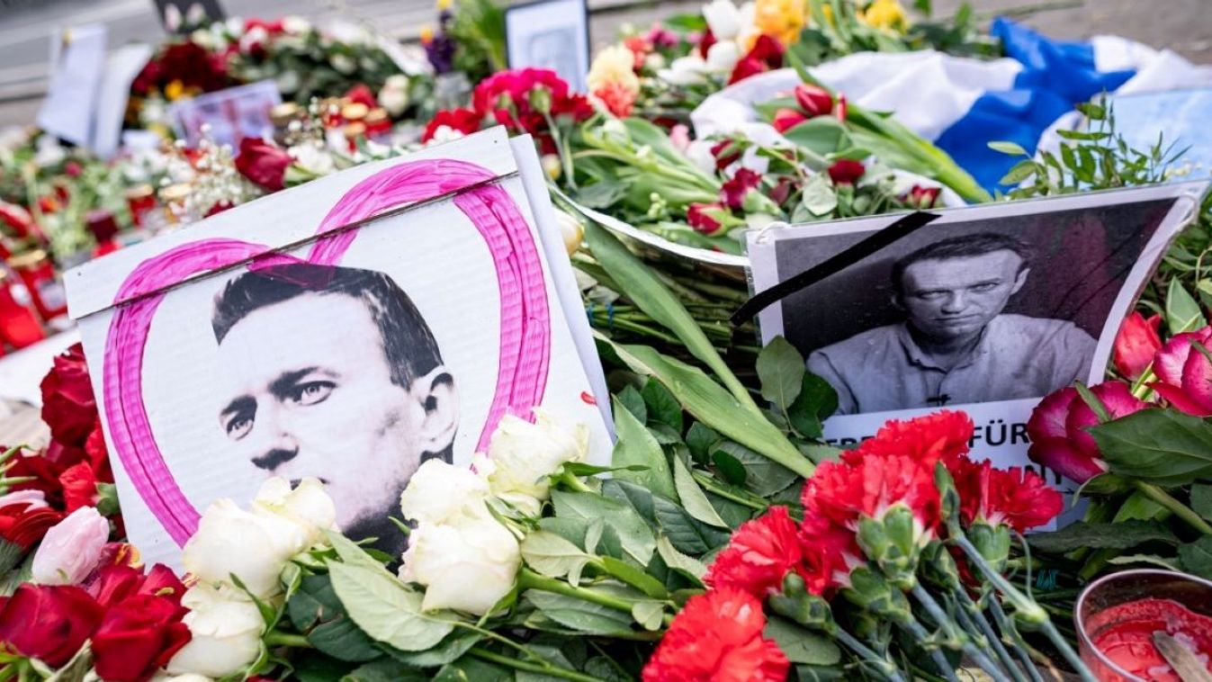 17 February 2024, Berlin: Numerous flowers and pictures lie in front of the Russian embassy following Navalny's death.