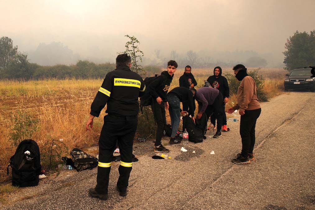 Irregular migrants stranded during wildfire in Dadia village of Greece