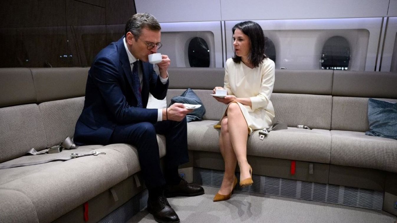 Annalena Baerbock (r, Alliance 90/The Greens), Foreign Minister, and Dmytro Kuleba, Foreign Minister of Ukraine, talk in an airplane (Airbus A350 - "Konrad Adenauer") of the Bundeswehr Air Force on the flight from New York to Berlin (Germany). Federal Foreign Minister Baerbock was in New York for the special sessions of the UN General Assembly and the UN Security Council to mark the second anniversary of the Russian invasion of Ukraine at the United Nations (UN).