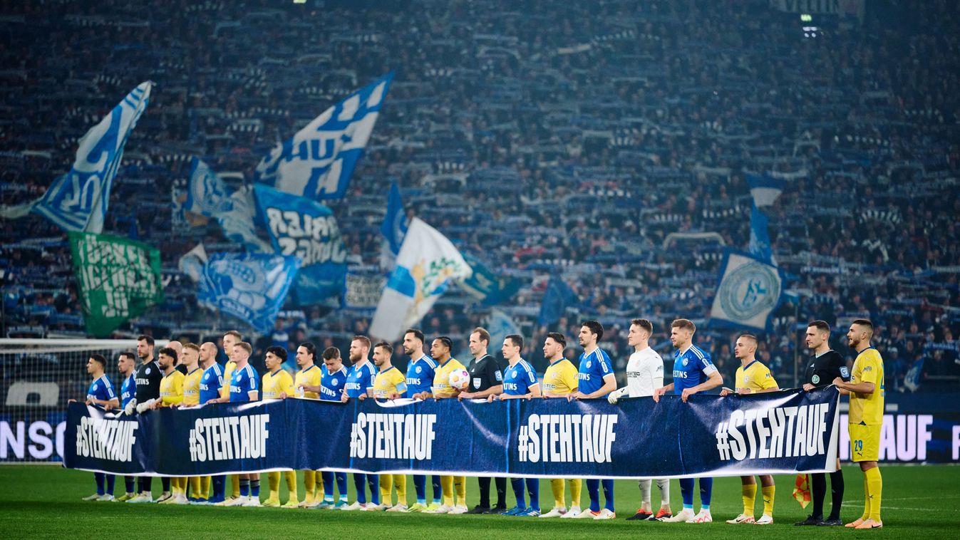 03 February 2024, North Rhine-Westphalia, Gelsenkirchen: Soccer: Bundesliga 2, FC Schalke 04 - Eintracht Braunschweig, matchday 20, Veltins Arena. Players from both teams take part in the "#STEHTAUF" (for democracy) campaign. Photo: Bernd Thissen/dpa - IMPORTANT NOTE: In accordance with the regulations of the DFL German Football League and the DFB German Football Association, it is prohibited to utilize or have utilized photographs taken in the stadium and/or of the match in the form of sequential images and/or video-like photo series. (Photo by BERND THISSEN / DPA / dpa Picture-Alliance via AFP)