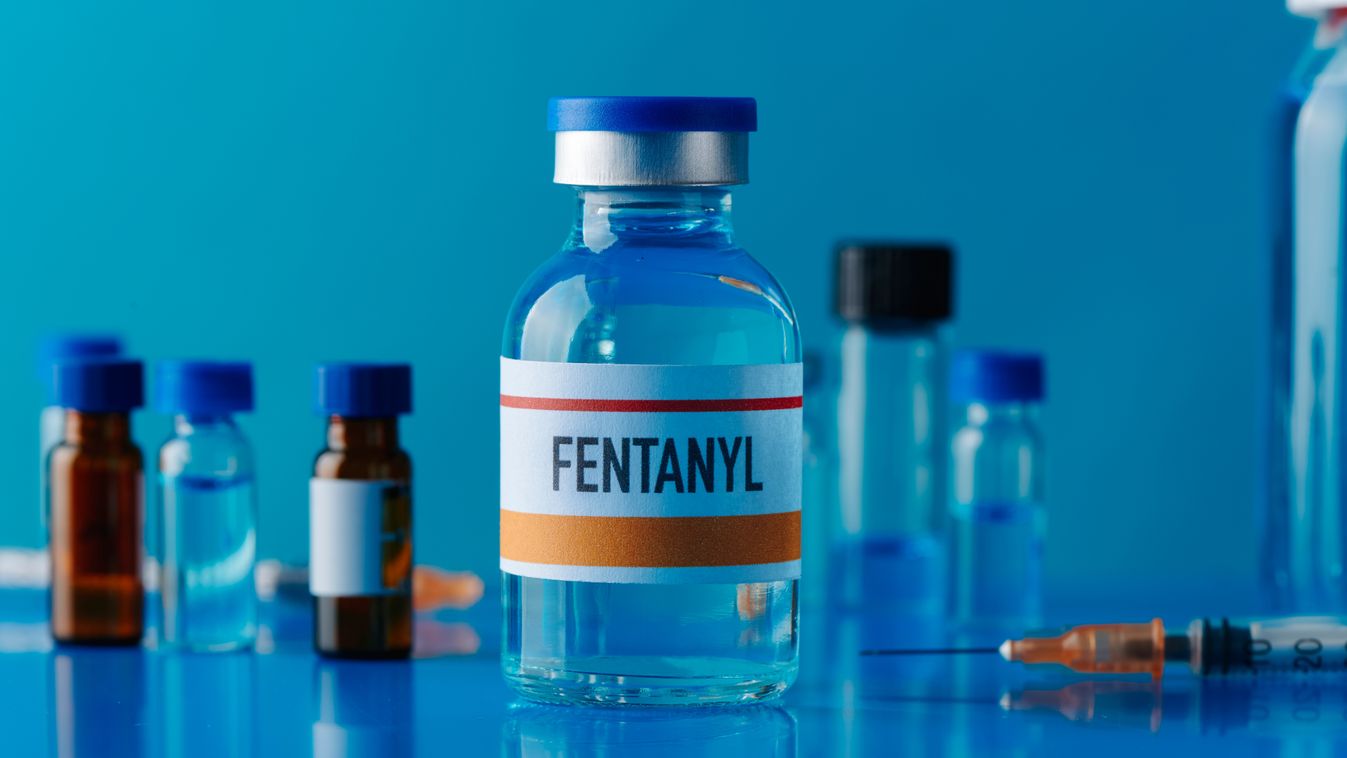 Closeup,Of,A,Simulated,Vial,Of,Fentanyl,On,A,Blue